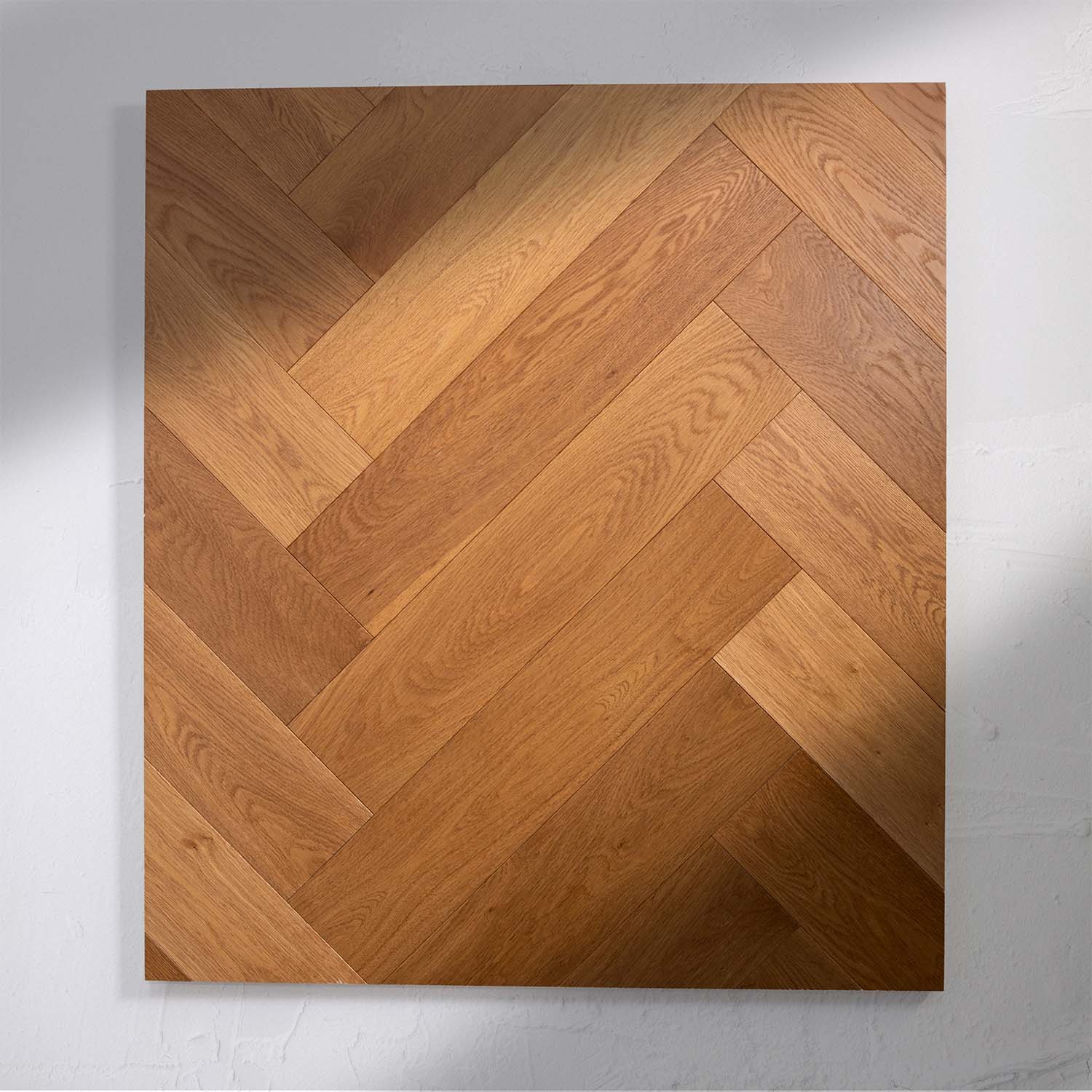 Top-down view of Beige Ash Engineered Timber Herringbone 15.3mm in Beige Ash colour neutral tone herringbone flooring sample