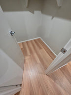 Installed room view of Natural Blackbutt SPC 9.5mm SPC hybrid flooring sample
