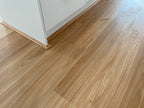 Installed room view of Natural Blackbutt SPC 9.5mm SPC hybrid flooring sample
