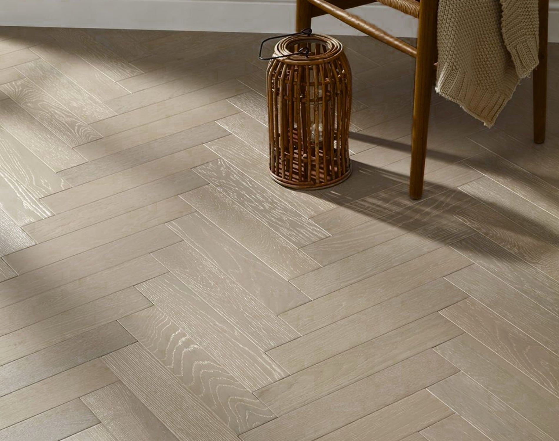 Flat lay of Light Malt Engineered Timber Herringbone 15.3mm in Light Malt colour light tone herringbone flooring sample