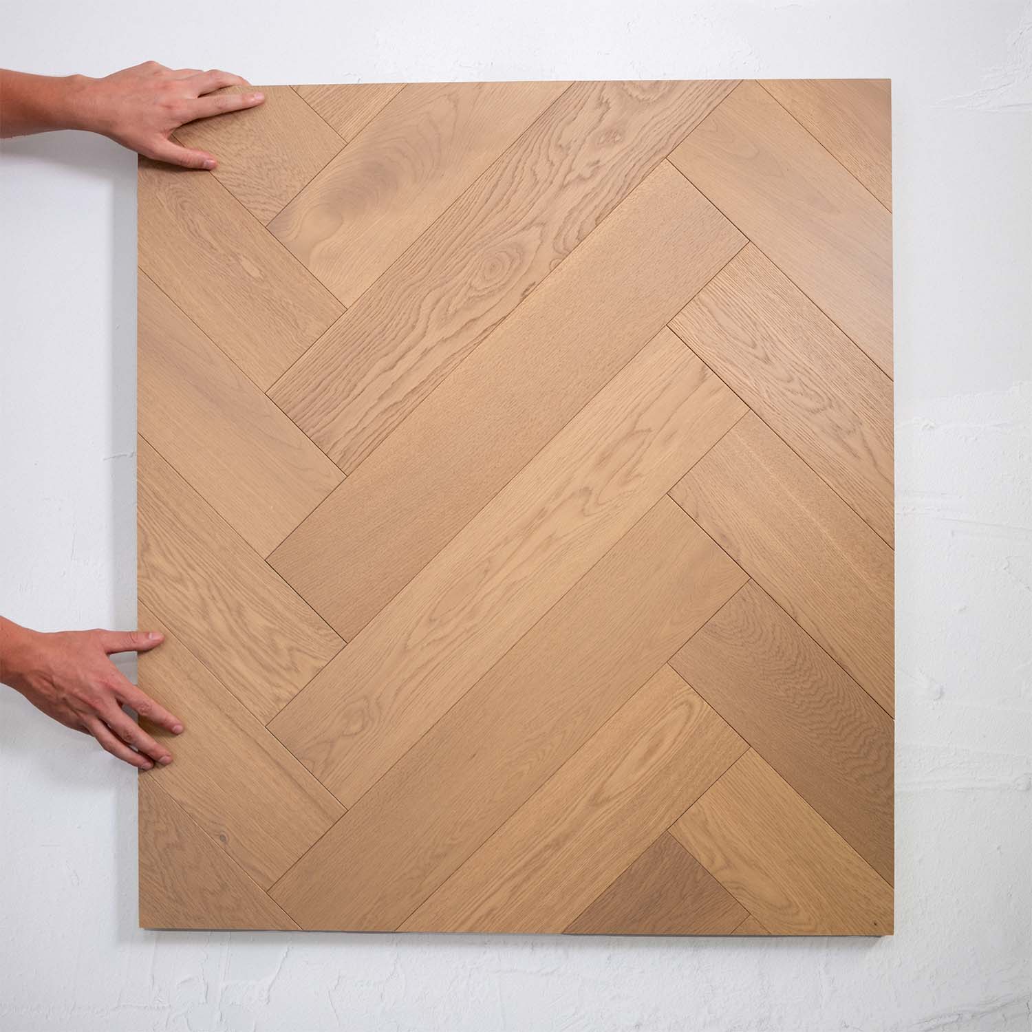Front view of Light Neutral Engineered Timber Herringbone 15.3mm in Light Neutral colour light tone herringbone flooring sample