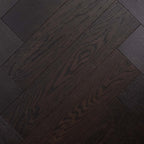 Top-down view of Midnight Grey Engineered Timber Herringbone 15.3mm in Midnight Grey colour dark shade herringbone flooring sample