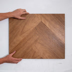Top-down view of Pacific Spotted Gum SPC Hybrid Floorboards Herringbone 7.5+2mm in Pacific Spotted colour warm tone herringbone flooring sample