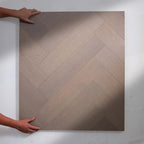 Top-down view of Pale Oak Engineered Timber Herringbone 15.3mm in Pale Oak colour warm tone herringbone flooring sample