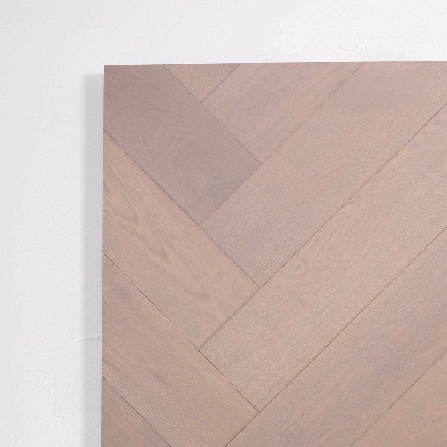 Perspective view of Pale Oak Engineered Timber Herringbone 15.3mm in Pale Oak colour warm tone herringbone flooring sample